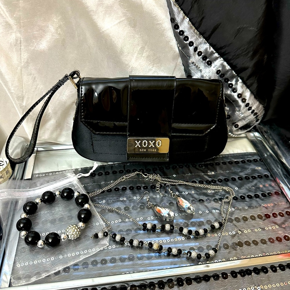 XOXO New York clutch and three pieces of jewelry set